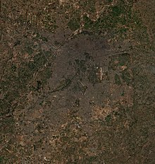 Lahore as seen from International Space Station. River Ravi flows from North to West. Lahore Satellite view.jpg