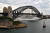 cruise ship sailing under the Harbour Bridge