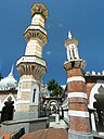 ☎∈ Original part (left) and extension (right) of Jamek mosque in Kuala Lumpur, Malaysia exhibiting differently coloured bricks.