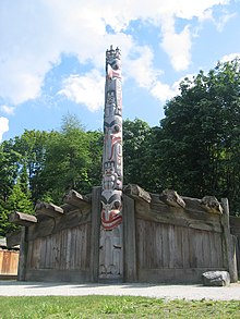 A totem pole outside a six-post house at the University of British Columbia