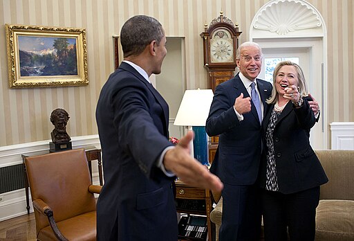 President Barack Obama, Vice President Joe Biden, and Secretary of State Hillary Clinton in the Oval Office. Public Domain.