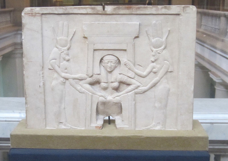 File:Plaque of a woman giving birth assisted by Hathor.jpg