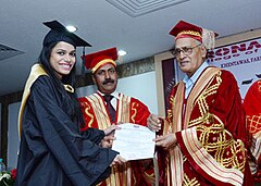 Prof Chopra as Chief Guest at DCE presenting an award to a student.jpg