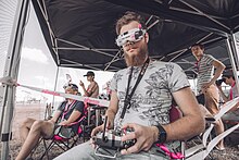 Drone racer piloting a drone REN 6266.jpg