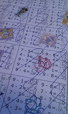 An arithmetic worksheet filled in by a dyscalculic child with teachers grading marks obscuring the child penmanship Rijtjes sommen beloning.jpg