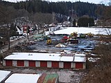 Rudník - výstavba kanalizace, stavební dvůr, v pozadí hříště TJ Avon
