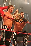 Sabin TNA Tag Champion.jpg