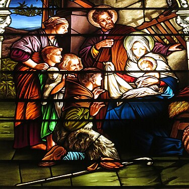 Stained glass window from the church depicting the Adoration of the Shepherds Saint Mary Catholic Church (Dayton, Ohio) - stained glass, Adoration of the Shepherds - tight crop.JPG