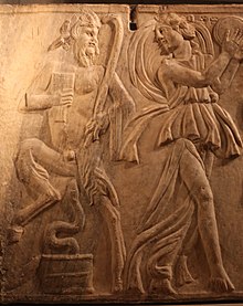Third-century relief carving from a Roman sarcophagus showing Pan dancing with a maenad ("mad woman") playing a tambourine Sarcophagus Triumph of Bacchus-IMG 9721.JPG