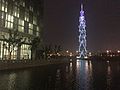 The Tower of ShanghaiTech at night. The library is partially in view on the left.