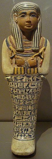 Egyptian faience ushabti of Lady Sati. New Kingdom, Dynasty XVIII, reign of Amenhotep III, c. 1390-1352 BC. Possibly from Saqqara. Shawabti of Lady Sati.jpg