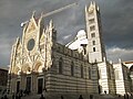 Siena Cathedra in sunlight with snow cloudsl.JPG