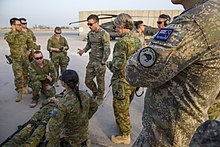 Australian Defence Force, New Zealand Defence Force, and US Army personnel conduct medevac training exercises at Camp Taji, Iraq, in 2018 TG Taji Health Co and TF Liberty MEDEVAC Training, 2018.jpg