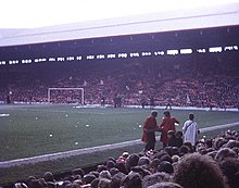 The Kop in 1974, before the Taylor Report recommended standing areas in football grounds be outlawed following the Hillsborough disaster in 1989. The Kop - geograph.org.uk - 702695.jpg