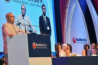 The President, Shri Pranab Mukherjee addressing at the first foundation day of Bandhan Bank, in Kolkata on August 23, 2016. The Governor of West Bengal, Shri Keshari Nath Tripathi is also seen.jpg