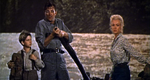 Tommy Rettig, Robert Mitchum and Marilyn Monroe in River of No Return.png
