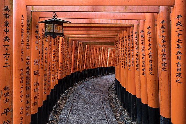 Torii path with a lantern at Fushimi Inari-taisha