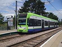 A Tramlink tram bound for Beckenham Junction stopping at Arena station Tram 2548 at Arena.jpg