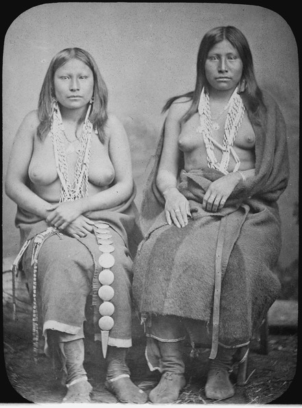 Two female Wichita people in summer dress in 1870
