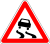 Ua 1.13 warning-slippery pavement.svg