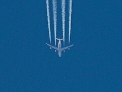 An Airbus A340 of Lufthansa produces contrails