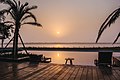 View of swimming pool of Sonar Bangla Taki during sunrise. The river Ichchamati flowing in the distance which is the international border between India and Bangladesh in this area.jpg