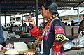 Woman of Yi nationality at the market, China