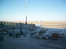 Air Canada Embraer E190 at the gate YWG Air Canada E190.JPG