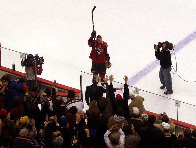 Marian Gaborik waves to the crowd after a five-goal performance against the New York Rangers in the 2007–08 season.