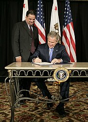 Pombo with President George W. Bush as he signs the Partners for Fish and Wildlife Act into law 20061003-13 George W. Bush and Richard Pombo d-0019-3-714v.jpg