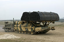 An AVRE carrying fascine and towing Python on Salisbury Plain.