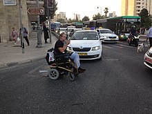 Ofer Sofer blocks Paris Square in Jerusalem during the demonstration for equalizing the disability pension to the minimum wage, not far from the Israel Prime Minister's house, 28 June 2018. A Demonstration of Disabled People June2018 4.jpg