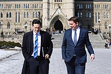 Poilievre on Parliament Hill with then Conservative leader Andrew Scheer in 2018 Andrew Scheer - 39827097354.jpg