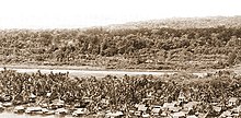 Bintulu fishing village in the 1950s. Behind the fishing village was the airstrip. Bintulu fishing village in 1950s.jpg