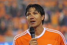 The LA Galaxy selected Brian Ching 16th overall. In 2004, he won the MLS Comeback Player of the Year Award and was named to the MLS Best XI. He earned 45 caps for the US Men's National Team and was selected to the 2006 FIFA World Cup squad. Brian Ching Testimonial Match Speaking After The Game.JPG