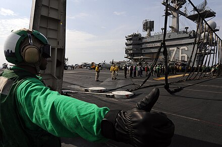 A barricade is raised on USS Ronald Reagan. Barricade usage is a rare emergency measure.