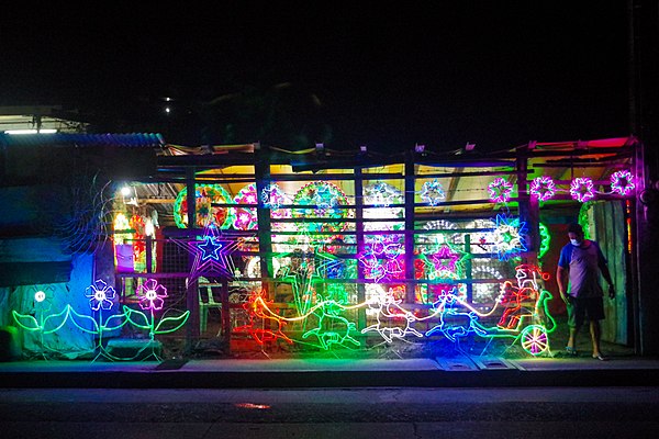 Parols and Christmas lights on display at night. The parol is regarded as an iconic and important symbol of the Filipino Christmas season.