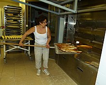 Baking bread in a commercial oven Defournement.jpg