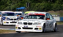 Second in the championship, Dirk Muller Dirk Muller - BMW 320i at The Esses at the 2004 ETCC rnds 11-12 at Donington (50897623348).jpg