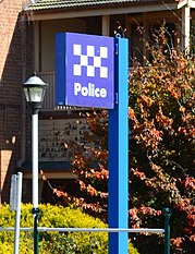 A standard police station sign Goulburn Police Station 001 (cropped).JPG