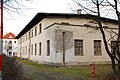 Handwerkerbau Ringstraße 53 auf dem Gelände des Isar-Amper-Klinikum München-Ost (zuvor Bezirkskrankenhaus Haar, davor Kreis-Heil- und Pflegeanstalt Haar) in Haar, Landkreis München, Regierungsbezirk Oberbayern, Bayern. Als Baudenkmal unter Aktennummer D-1-84-123-9 in der Bayerischen Denkmalliste aufgeführt.