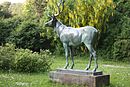 Bronze sculpture "Standing Deer" on the Anger