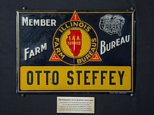 This fence sign once belonged to Otto Steffey, the Illinois Farm Bureau president when IFB headquarters moved from Chicago to Bloomington. The sign was part of a time capsule that was buried after the move and was then unsealed in honor of the IFB's 100th birthday. ILFB Member Sign - Otto Steffey.jpg