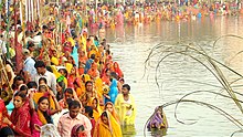 People gathered at a pond in Janakpur, Nepal to worship Surya, the sun god and his consort Chhathi Maiya (2008) JanakpurChhathParvaFestival.jpg