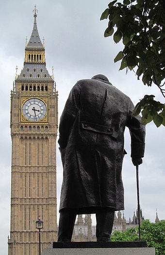 The statue overlooks the Houses of Parliament