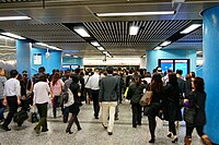 People rush to another line in MTR Admiralty Station