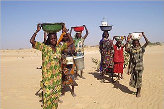 Women in Mao, where water is provided by a water tower. Access to clean water is often a problem in Chad. Mao Women.jpg