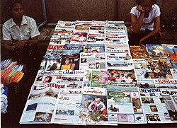 Newspapers in the street of Yangon (February 2006) including publications also in English Marchand de journaux a Yangon.jpg