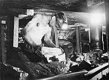 A miner working in a narrow coal seam, Britain 1942 Men of the Mine- Life at the Coal Face, Britain, 1942 D8268.jpg