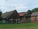 Homestead with house, barn, laundry room and courtyard paving